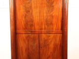 an image of a wooden cabinet with a clock on top of it