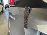 a close up of a car with a ruler on it ' s side