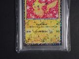 a card in a plastic case with a picture of a pikachu on it