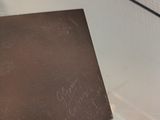 a glass table with a piece of paper on it