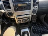 the interior of a car with a steering wheel and dashboard controls