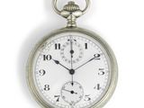 a silver pocket watch with roman numerals on the face