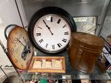 a glass table topped with a clock and other items
