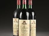 three bottles of wine sitting on top of a table next to each other