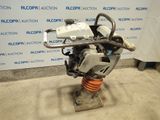the engine is sitting on a stand in front of a wall