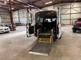 a white van with its door open in a garage