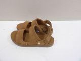a close up of a pair of sandals on a white surface