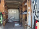 a white van with a bike in the back of it