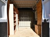 a white van with a door open in the back of it