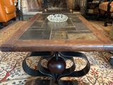a coffee table with a bowl on it in the middle of a living room