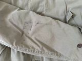 a close up of a pair of pants with a button on it