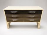 an image of a black and white dresser with three drawers