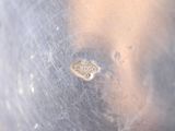 a close up of a piece of metal with a tag on it