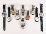 a lot of watches that are sitting on a table