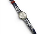 an image of a close up of a wrist watch on a white surface
