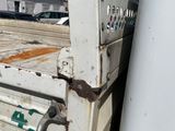 a white truck that is parked in the parking lot