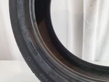 a close up of a tire on a white surface