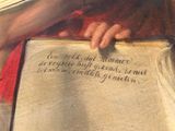 painting of a man holding a book with writing on it