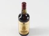 a bottle of wine that is sitting on a table