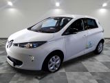 a picture of a white electric car on a checkered floor