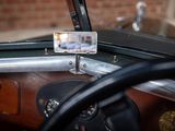 a cell phone that is sitting on the dashboard of a car