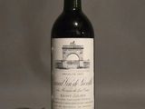 a bottle of wine that is sitting on a table
