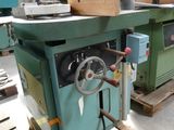 a machine that is sitting on a pallet in a warehouse