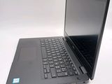 a laptop that is sitting on a white surface