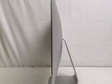 a computer monitor sitting on top of a white table