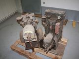 two engines sitting on a pallet in a room