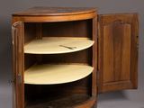 a small cabinet with two shelves and a door open