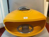 a yellow box with a silver handle sitting on a table