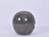 an image of a small metal object on a white surface