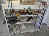 a shelf with tools on it in a garage