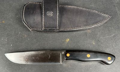 two knives on the table next to each other
