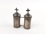 pair of silver salt and pepper shakers with crosses on top
