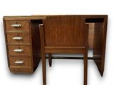 a desk with a chair and a desk top on it