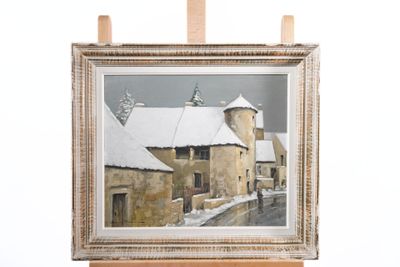 a picture of a painting hanging on a wooden easel