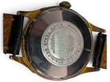 an image of a close up of a watch on a white surface