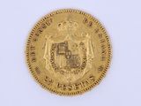 l'image d'une pièce d'or sur laquelle figurent des armoiries