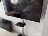 a flat screen tv sitting on a stand in a living room