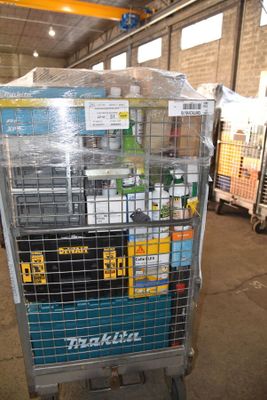 a metal cart with many items in it in a warehouse