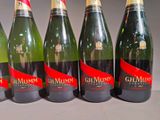 six bottles of champagne are lined up in a row