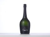 an empty bottle of wine sitting on top of a table