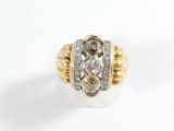 an image of a diamond and gold ring on a white surface