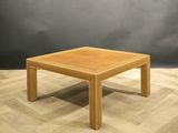 an image of a wooden coffee table on a wooden floor