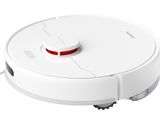 gros plan d'un aspirateur robot sur une surface blanche