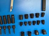 a lot of tools that are laying out on a blue surface