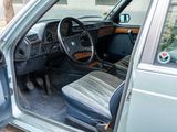 a car with the door open and the driver ' s seat down