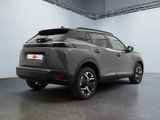 the rear end of a grey suv parked in a garage